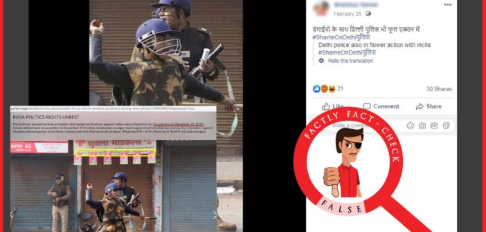 An old photo of UP Police shared as ‘Delhi Police throwing stones along with rioters’.